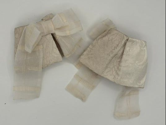 Cream lace cuff with bow and brocade fabric
