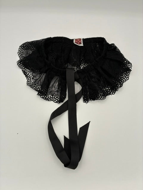 Black lace COLALR with a wide black ribbon tail, laid flat on a light gray background.